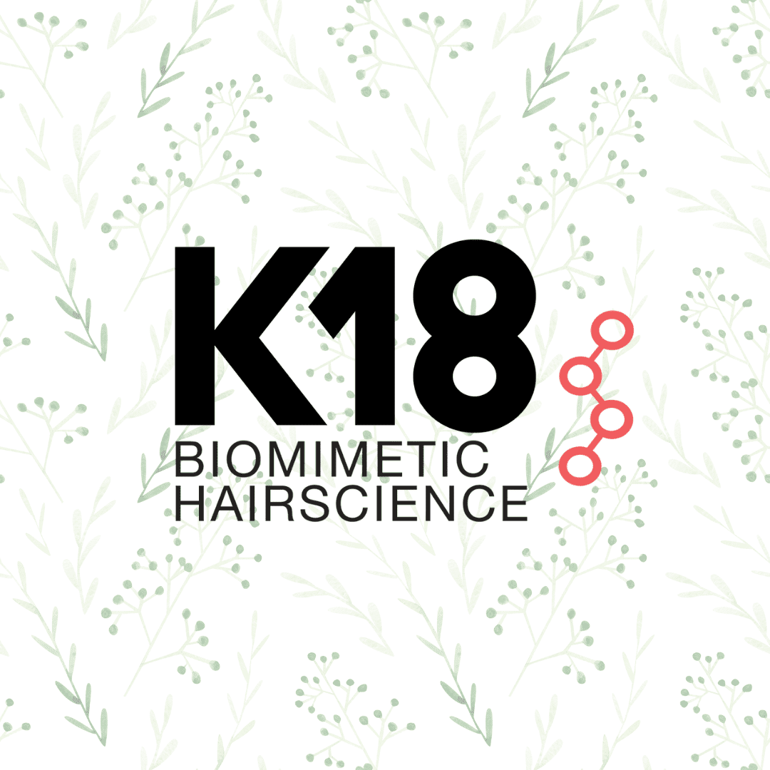 K18 Biomimetic Hairscience logo on a leafy background with a red molecular structure.